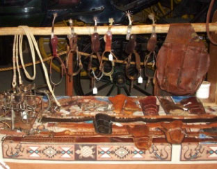 Display of leather goods including holsters and saddle bag