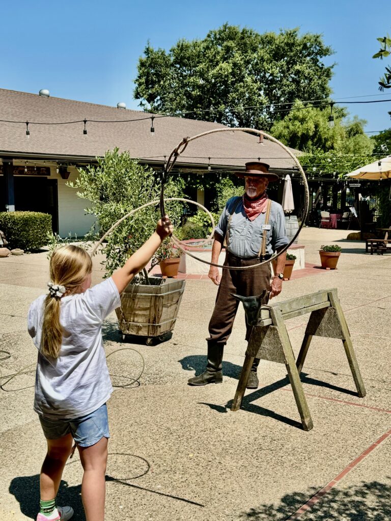 Girl learning how to rope at Wild West Camp 2024