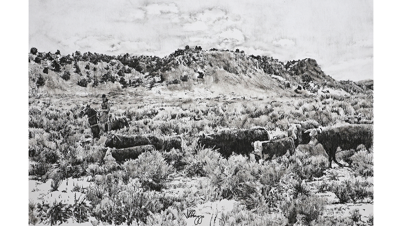 cowboy herding cattle on the range