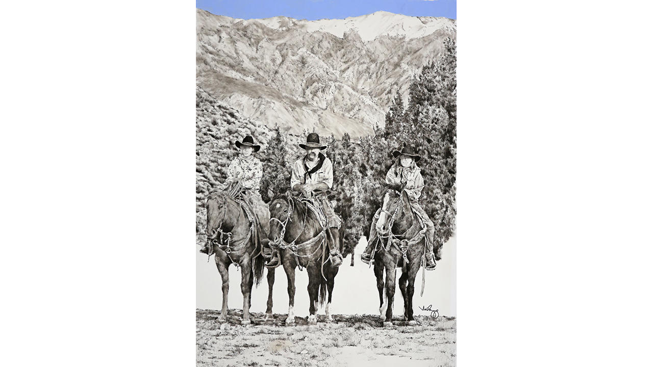 father, mother, and son on horseback with dramatic mountains behind