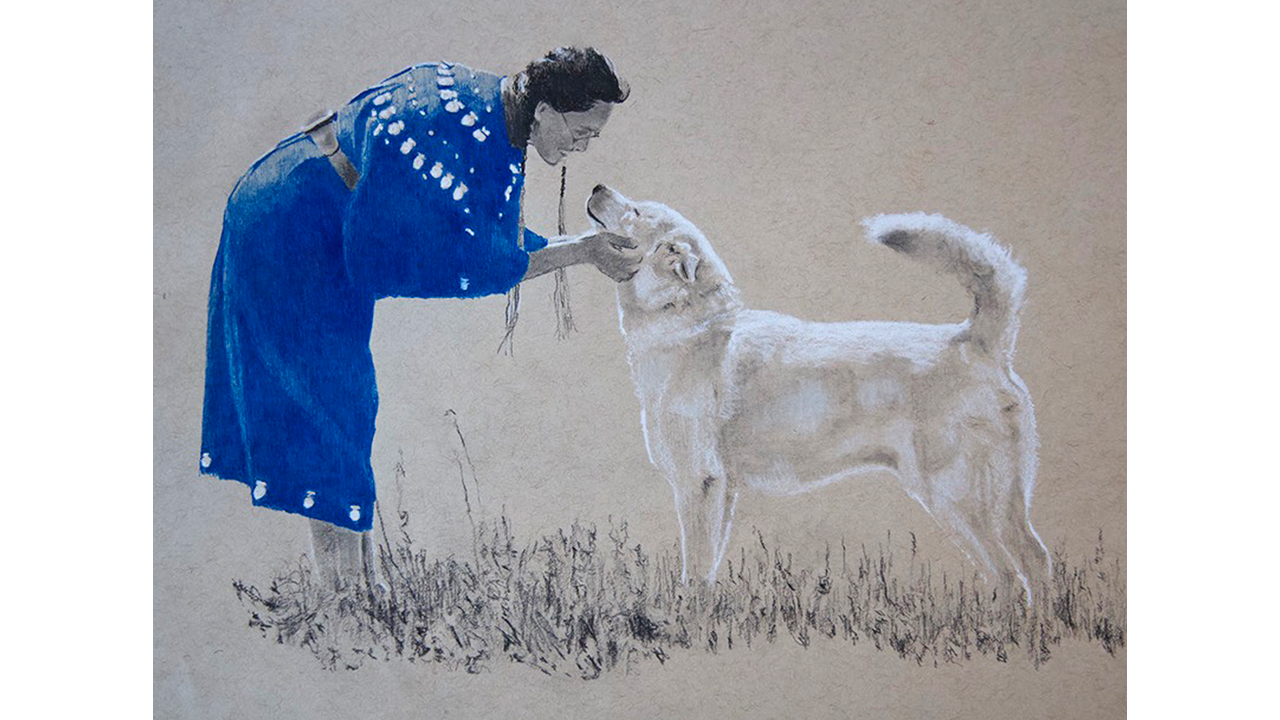 Lakota woman in blue dress bending down to greet white dog
