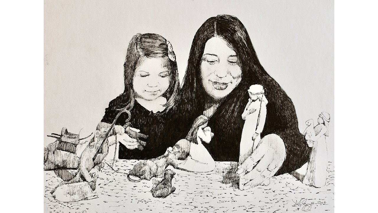 woman and girl setting up nativity pieces