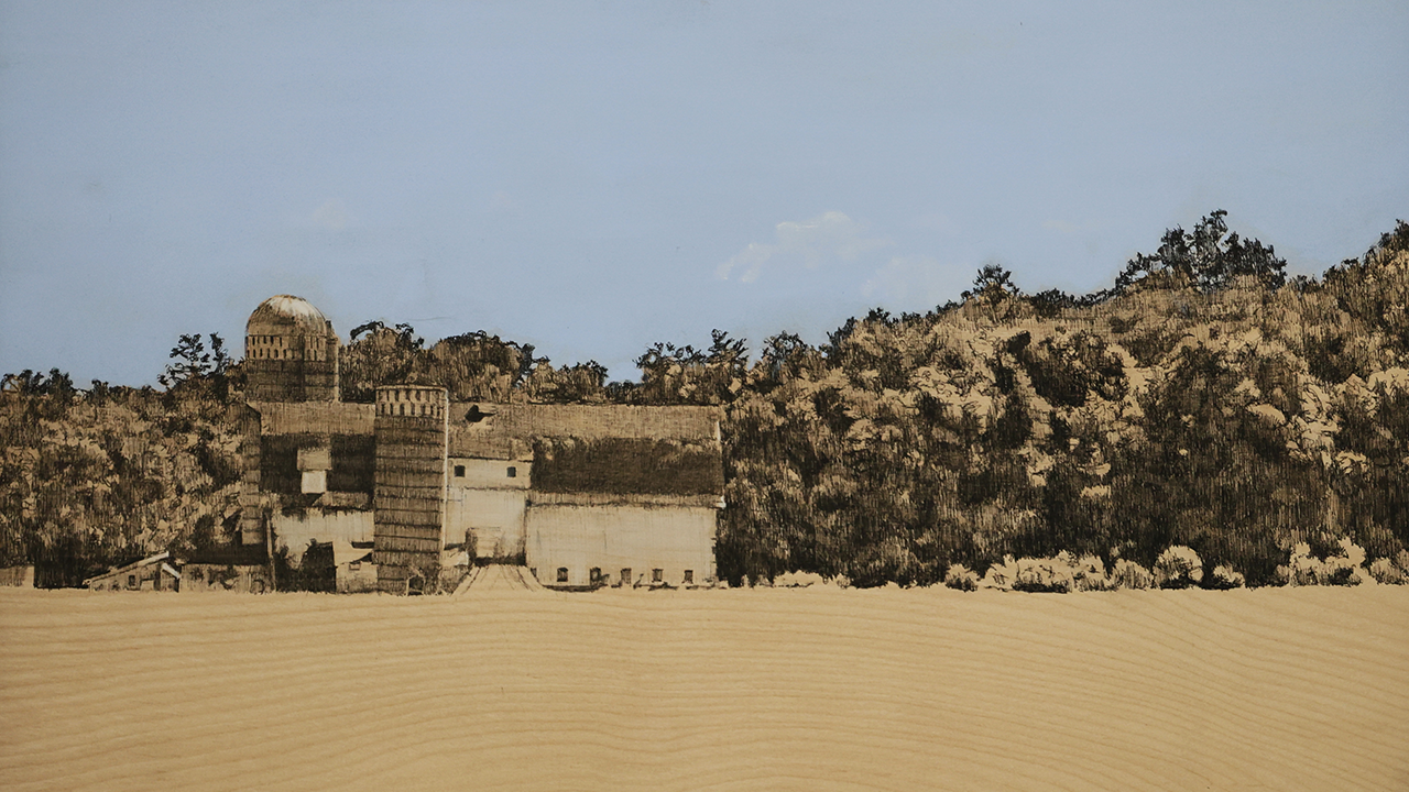 landscape of barn and silo among trees, blue sky