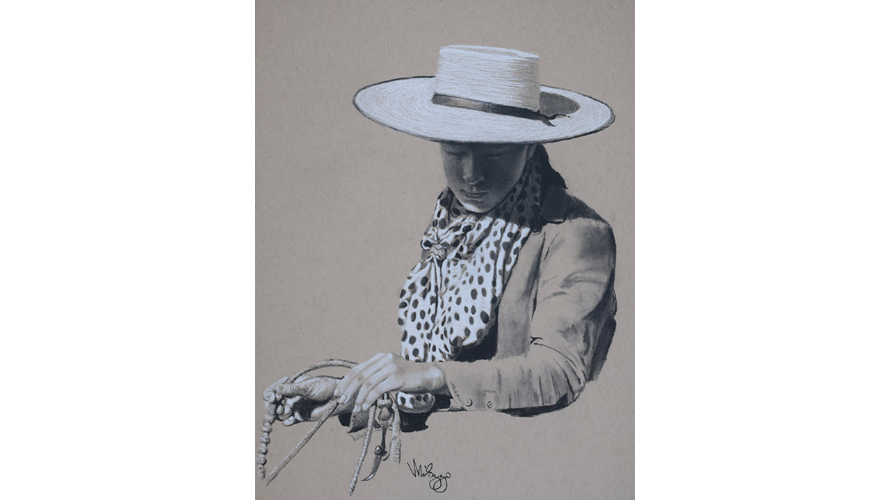 woman with flat-brimmed hat holding rope