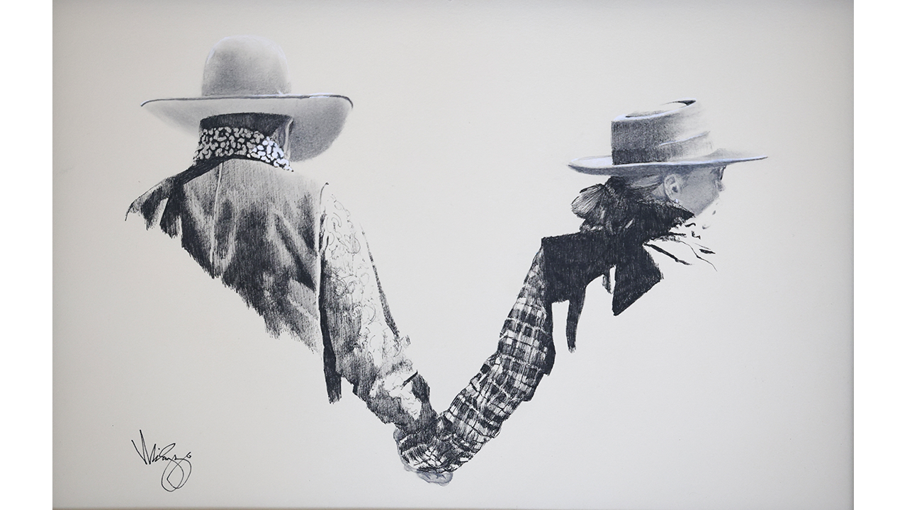man and woman in Western wear holding hands, forming a subtle heart against the negative space