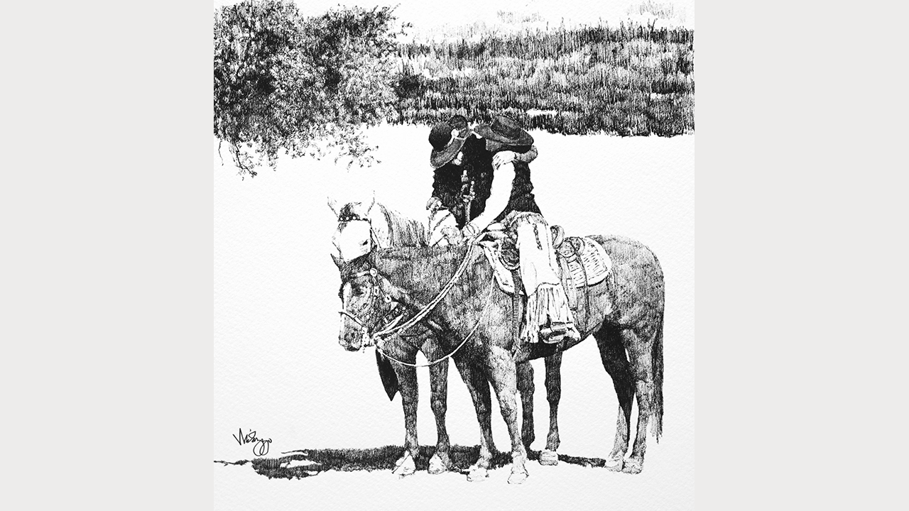 two horse riders embracing